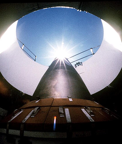 LGM-118A Peacekeeper intercontinental ballistic missile points skyward from its position in a silo - Public domain